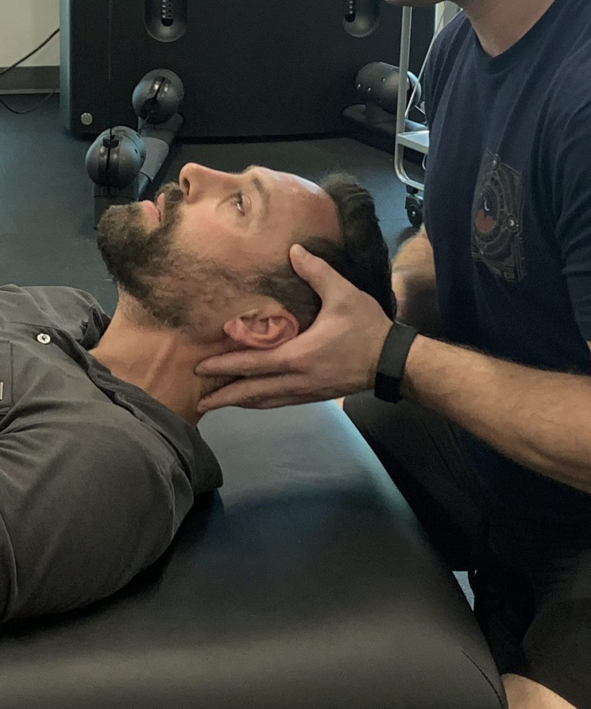 man having a neck therapy