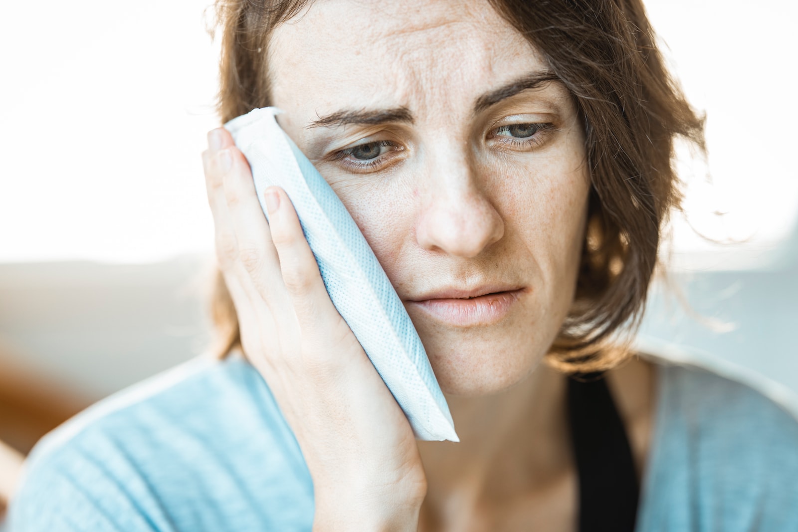 Women suffering from TMJ pain.